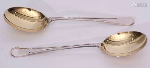 Two George V Arts & Crafts style serving spoons, stylised coffin end handles with double struck