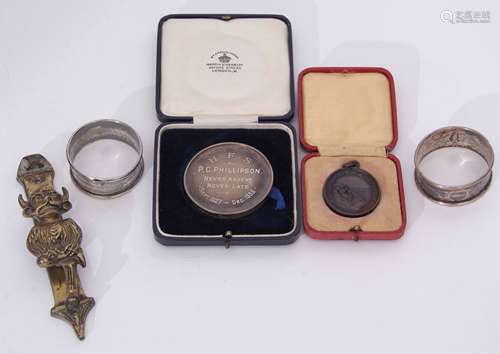 Mixed Lot: comprising two various cylindrical napkin rings together with a silver presentation