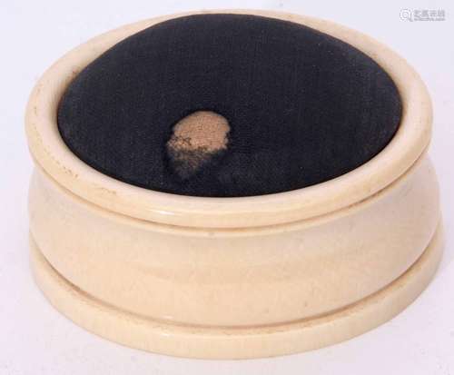 Late 19th/early 20th century ivory pin cushion of moulded oval form with fabric covered and hinged