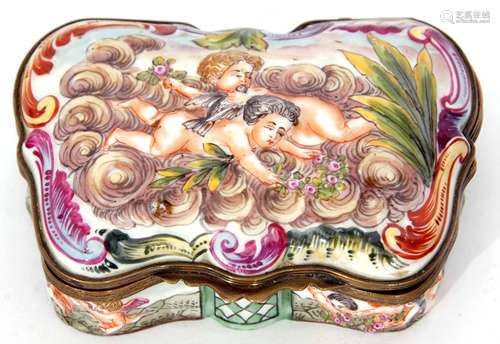 Continental porcelain and brass mounted snuff box of serpentine form, the hinged cover set with