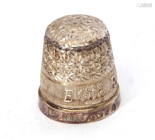 Elizabeth II commemorative silver thimble of typical form with milled band decorated with a crown,