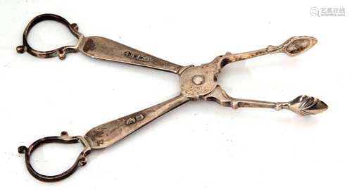 Pair of late Victorian sugar nips of scissor form, cast and applied handles and shell bowls,