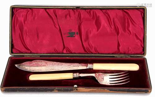 Cased set of ivory handled fish servers, each with engraved blade and tines to a ribbed collar and