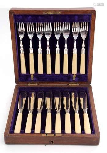 Early 20th century oak cased set of six each fish knives and forks each with polished blades and