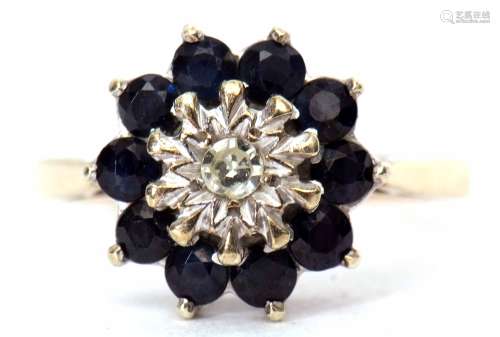 9ct gold, sapphire and diamond cluster ring, the small central diamond claw set in an illusion