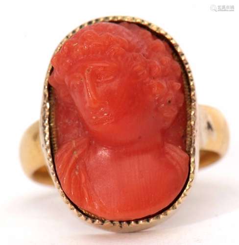 Antique carved coral ring, depicting a classical figure in a yellow metal frame to a 22ct gold