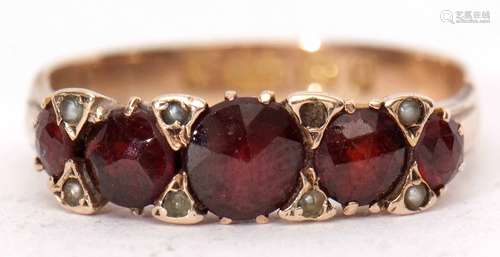 Victorian garnet and seed pearl ring, the five graduated circular cut garnets interspersed with