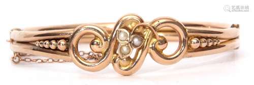 9ct stamped and seed pearl hinged bracelet, the tubular bead and scroll frame with a cluster seed