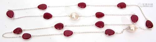 Modern white metal necklace set with sculptured rubies and baroque pearls, all framed and