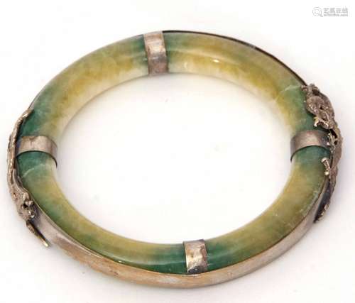 Jade type circular bangle, the surround applied with a metal dragon and mythological bird, 80mm diam