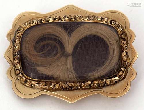 Victorian gilt metal memoriam brooch of shaped rectangular design with a framed glazed plaited