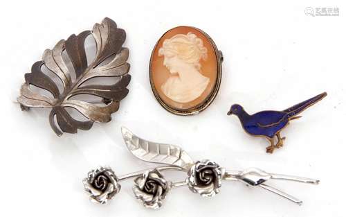 Mixed Lot: hallmarked silver pierced leaf brooch, Birmingham 1990, a white metal floral brooch