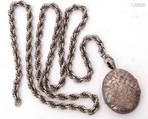 Large Victorian oval shaped metal locket, engraved front and back, suspended from a heavy metal rope