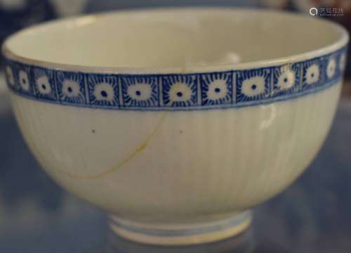 English 18th century tea bowl of ribbed form, probably Lowestoft, with flower sprig to interior, 8cm