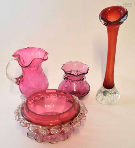 Group of cranberry coloured glass, one with a label for Swedish Art Glass, comprising vase, ewer and