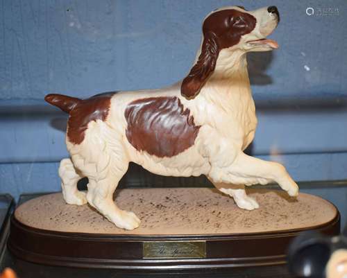 Model of a cocker spaniel by Beswick, on an oval base, 25cm long