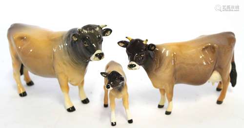 Group of three cattle designed by John Beswick, the bull marked Champion Onsley Coyboy, the cow