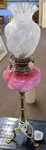 Victorian oil lamp, clear and etched glass shade over a pink glass font raised on a candlestick type