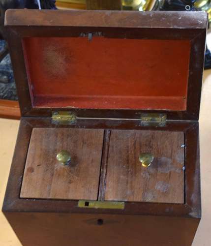 Victorian mahogany sarcophagus shaped tea caddy, lifting lid enclosing two lidded compartments, 18.