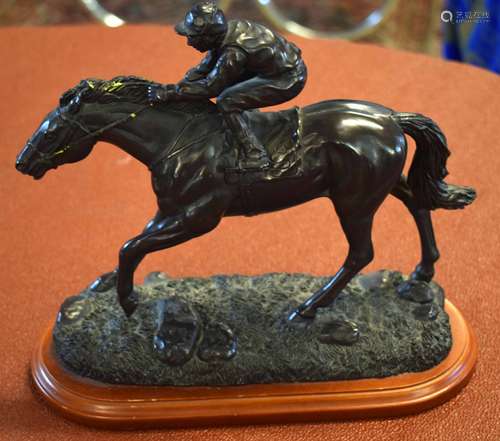 Modern bronze effect study of jockey and racehorse in full flight, 22cm high