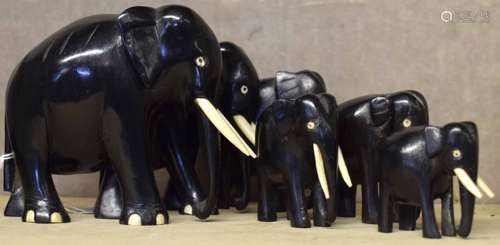 Graduated set of six vintage ebony and bone elephants, largest 10cm high