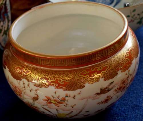 Japanese Kutani ware bowl decorated in iron red enamels with birds in flight and in branches amongst