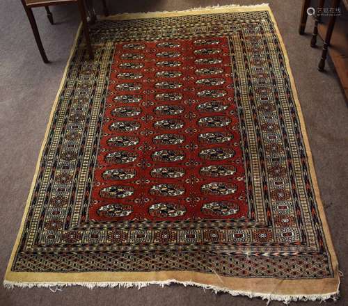 Bokhara style rug, central panel of lozenges, multi-gull border, 185 x 130cm