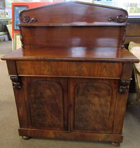 Victorian mahogany chiffonier with arched back over a shelf, lower section with full width drawer