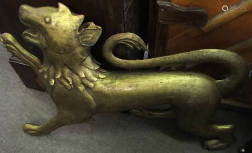 Gilt painted tin model of a rampant lion, 78cm long