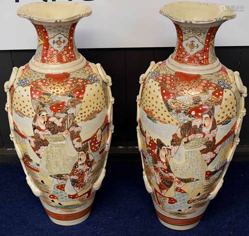 Two large Satsuma earthenware vases decorated in typical fashion with Japanese warriors and