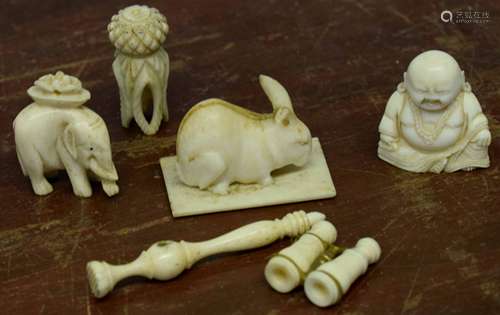 Small group of early 20th century ivory objects including a miniature pair of binoculars, model of