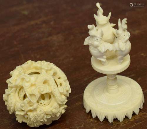 Chinese ivory puzzle ball mounted on a stand with three elephants, 9cm high