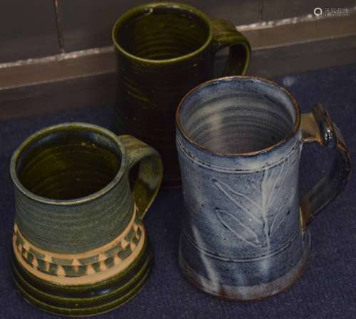 Two late 18th/early 19th century pearlware Bacchus jugs modelled in typical fashion, together with a