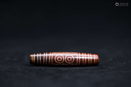 A Chinese Carved Agate DZI Bead