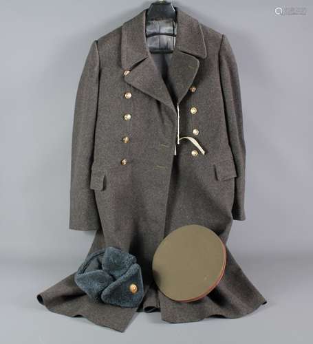 A Russian Soviet Period Grey Great Coat; the coat includes two hats and Colonel rank epaulettes