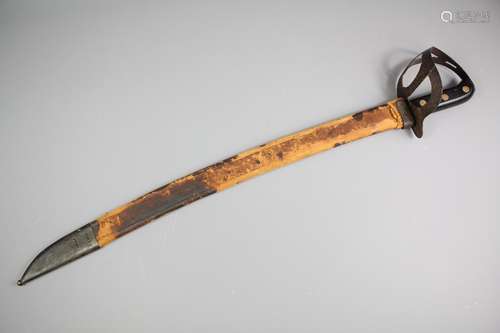 A 1898 Dutch Klewang Naval Cutlass, curved single fullered blade terminating in a short clip point, half-basket guard with paired wood grips united by three brass rivets, contained in it's original leather scabbard