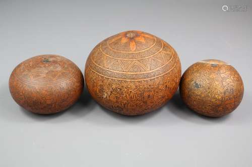 Three Peruvian Gourds; the gourds depicting scenes of rural life