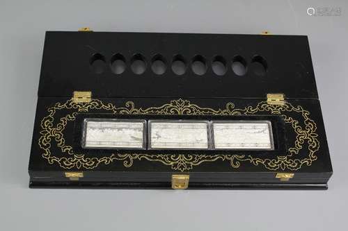 A Chinese Lacquer Silver Ingot Presentation Box; the box containing six silver ingots, the box approx 17 l x 11 w cms