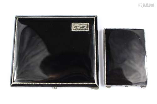 A Continental Art Deco Silver and Black Enamel Cigarette Case and Match Box, monogrammed NJG, stamped 925, London import marks, mm AJ, dated 1929 the matchbox bears similar marks dated 1930