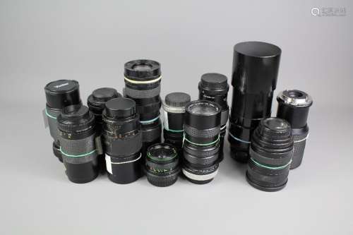 A Quantity of Camera Lenses; the lenses including an Optomax Auto Zoom 85-205mm lens (missing base mount); Hanimex Auto Zoom 80-200mm Macro lens, Kenlock 200 mm Telephoto Lens, Soligor 300 mm Tele Auto Lens; Itorex 80-200mm Macro Lens; Vivitar 70-150 mm Close Focus Lens, Vivitar 80-200mm Macro Lens; Optomax 200mm Telephoto Lens, Chinon 35-100mm Zoom Lens, Promura 135mm, Helios Auto Zoom 75-100mm, Hanimex Automatic 28mm