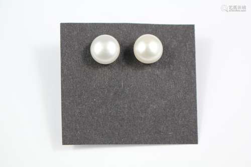 A Pair of Cultured Pearl Stud Earrings, on silver posts