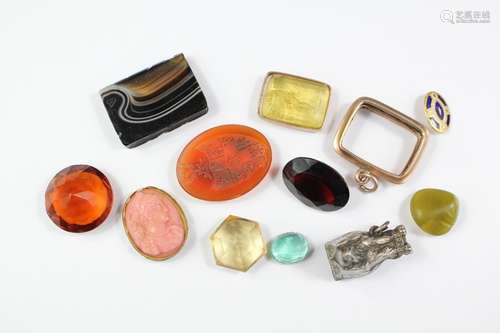 Miscellaneous Collection of Semi-Precious Stones, including a carved yellow-carved stone in a 9ct gold mount, carnelian seal amongst others