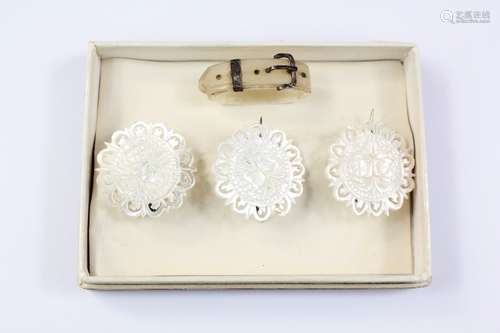 A Set of Three Mother of Pearl Buttons, together with a mother scarf ring