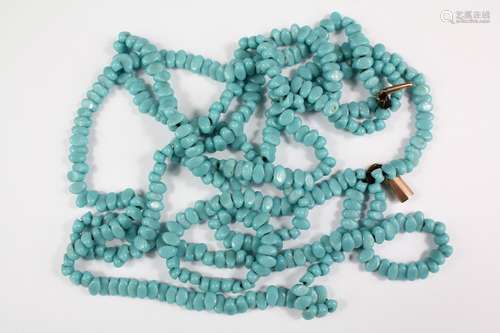 An Antique Four Strand Turquoise Necklace, approx 38 cms on a 9ct rose-gold clasp