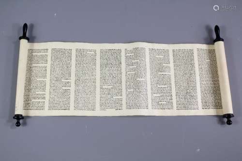 A Hebrew Scroll; the scroll with ebonised scroll caps, approx 15 cms wide