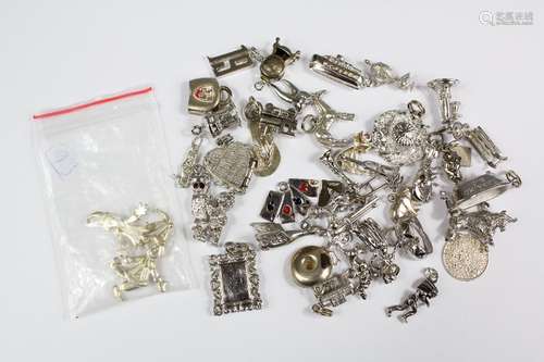 Miscellaneous Sterling Silver Charms, together with two silver clown pendants with articulated limbs, 80 gms