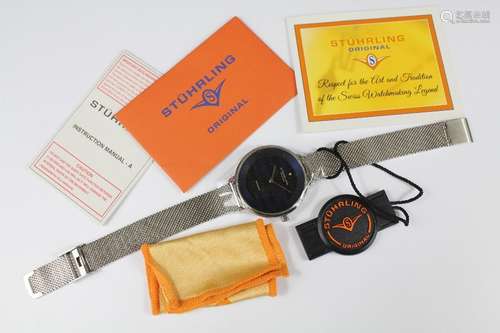 A Stuhrling Stainless Steel Wrist Watch, complete with original paperwork and guarantee card