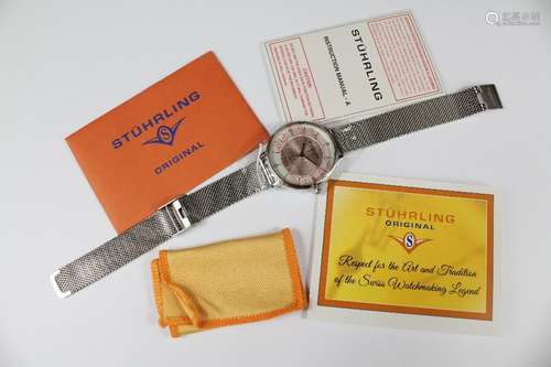 A Stuhrling Stainless Steel Wrist Watch, complete with original paperwork and guarantee card