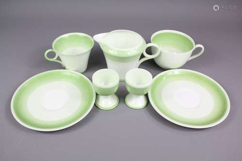 A Part Vintage Shelley Tea and Coffee Set, comprising six coffee cups and saucers, nine tea cups and saucers, four large breakfast tea cups and four egg cups, factory marks to base Reg marks C