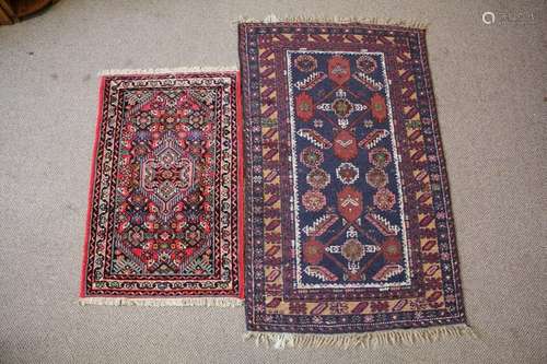 Two Small Woollen Carpets, the first having jewel colours hand-woven in Iran approx 60 w x 95 l cms, the second a hand-woven woolen carpet, blue ground with geometric burgundy and cream design, approx 135 x 65 cms